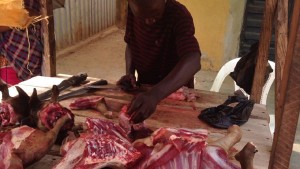 meat-displayed-on-table-with-Seller